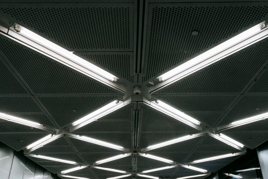 commercial electric LED light installation in modern office