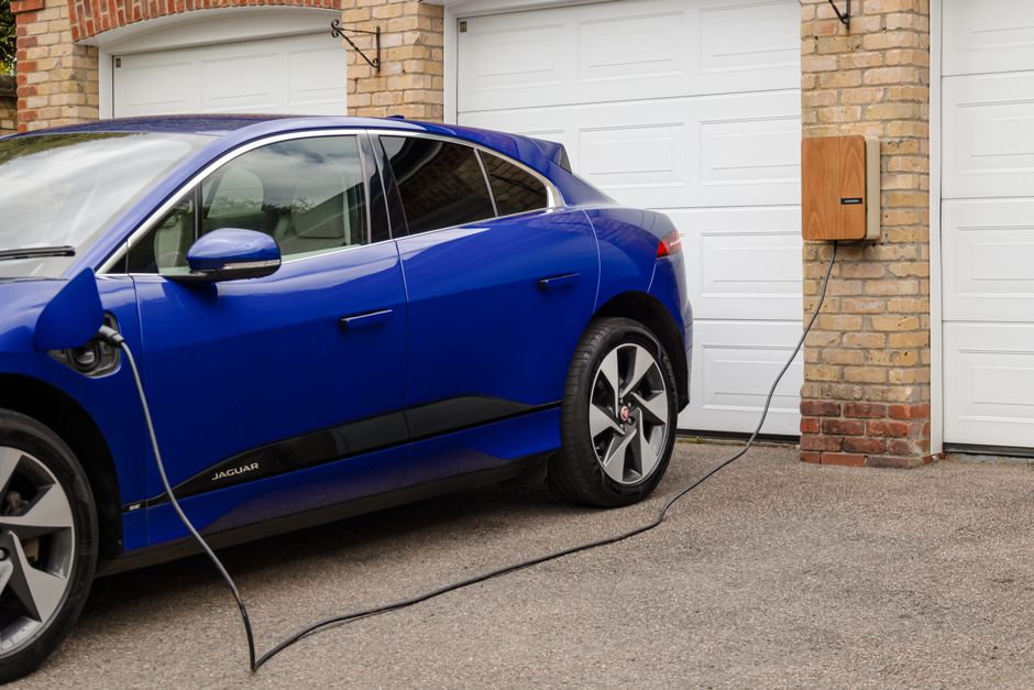 Level 2 residential charging station mounted on a garage wall